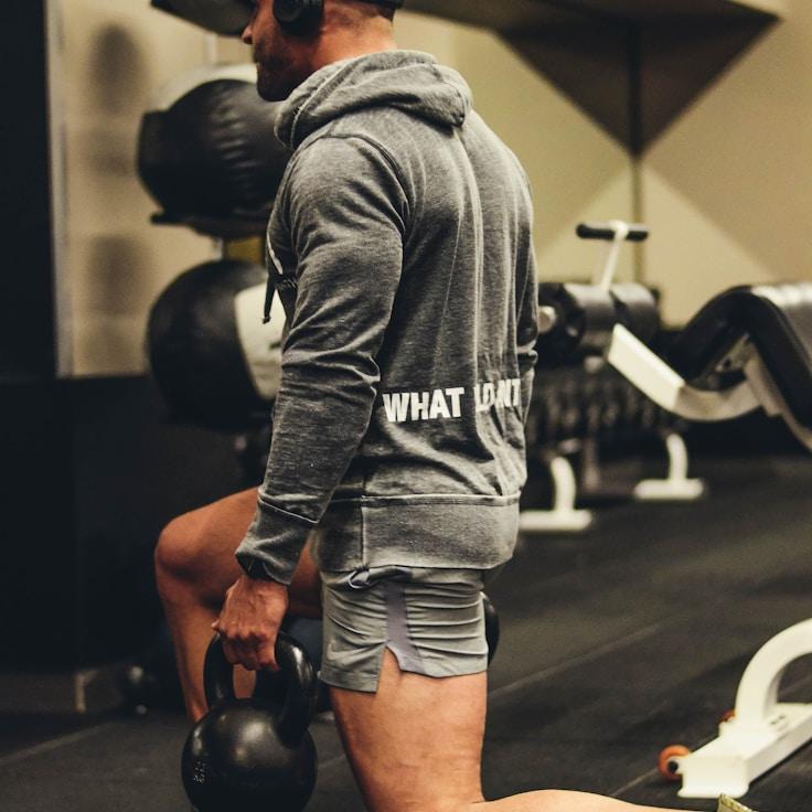 Interior of a professional gym with weight training equipment and mirrors